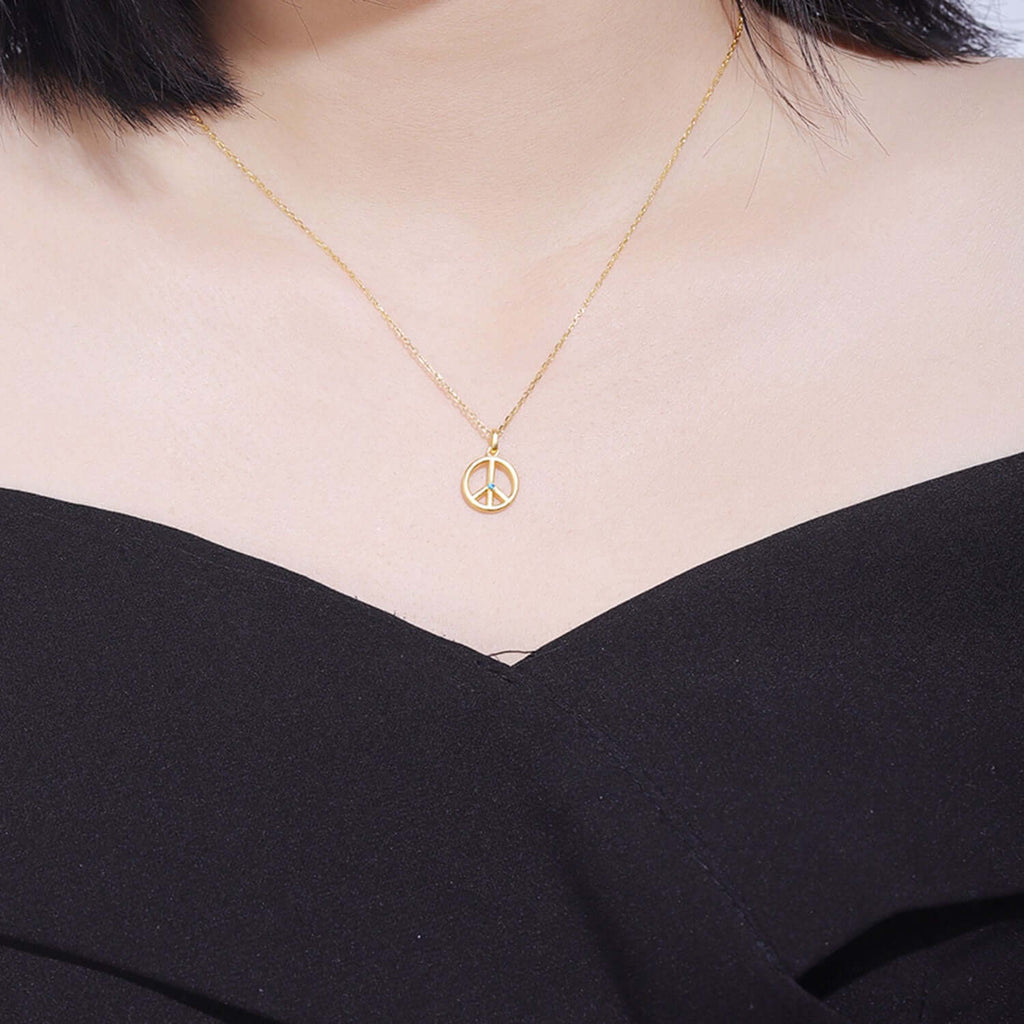 Woman wearing 18k Gold Peace Sign Necklace 