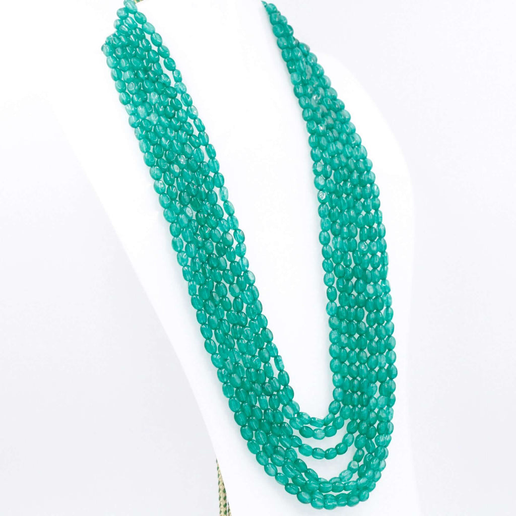 Long, multistrand necklace featuring green quartz gemstones