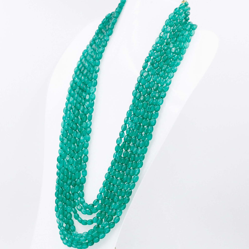 Gemstone necklace with multiple strands of green quartz