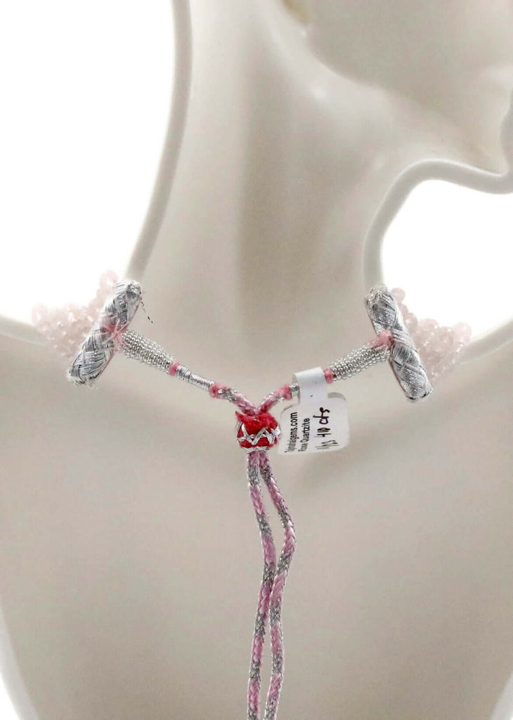 a red pendant with silver chain 